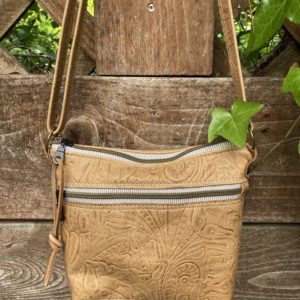 Tan embossed leaf and floral bag