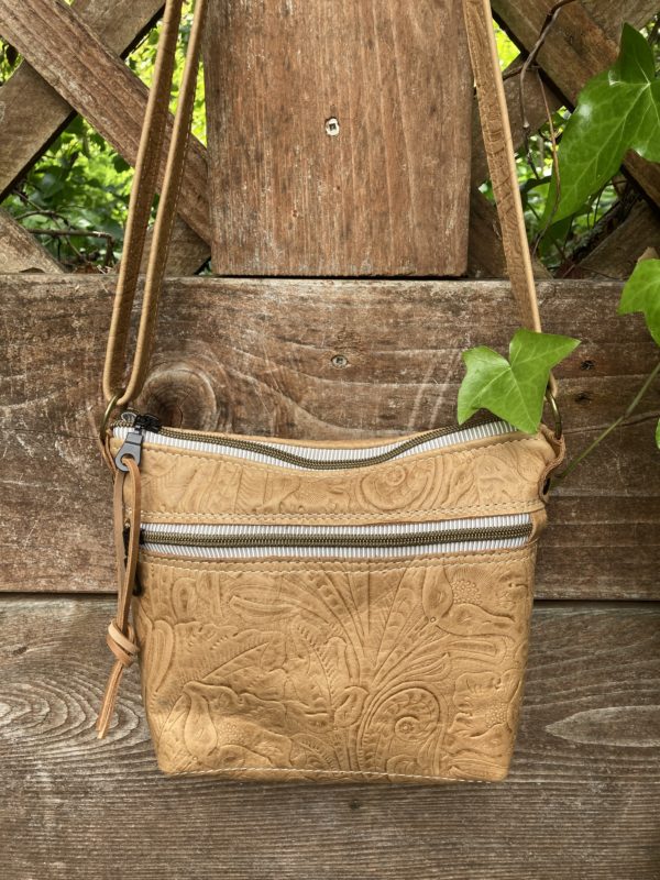 Tan embossed leaf and floral bag