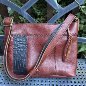 Chestnut and black leather bag